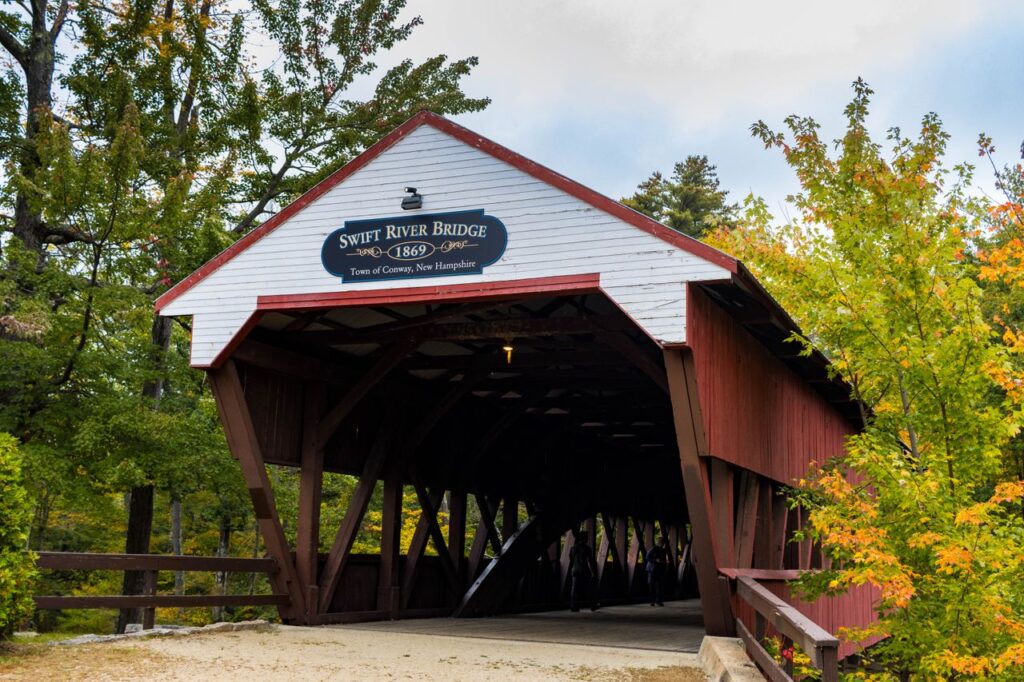Explore the rustic charm of the Swift River Covered Bridge, a classic landmark in Conway, New Hampshire.